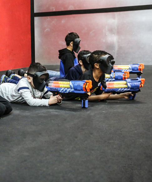 4 kids with nerf guns indoors in London 